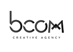 B COM' • Creative Agency logo